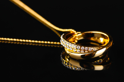 Gold ring pendant on a necklace